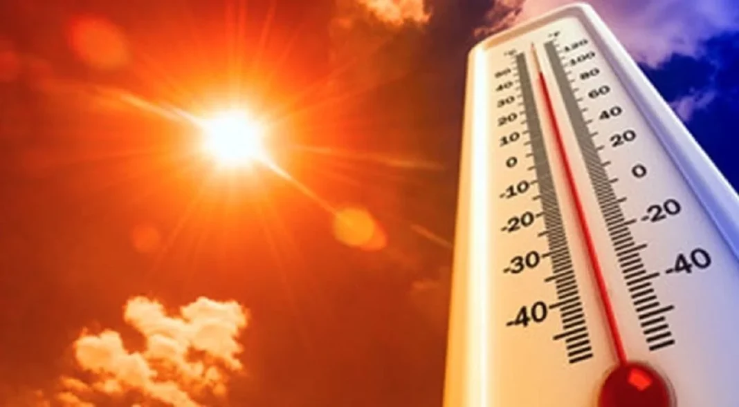 Thermomètre indiquant des températures élevées sous un soleil brûlant.