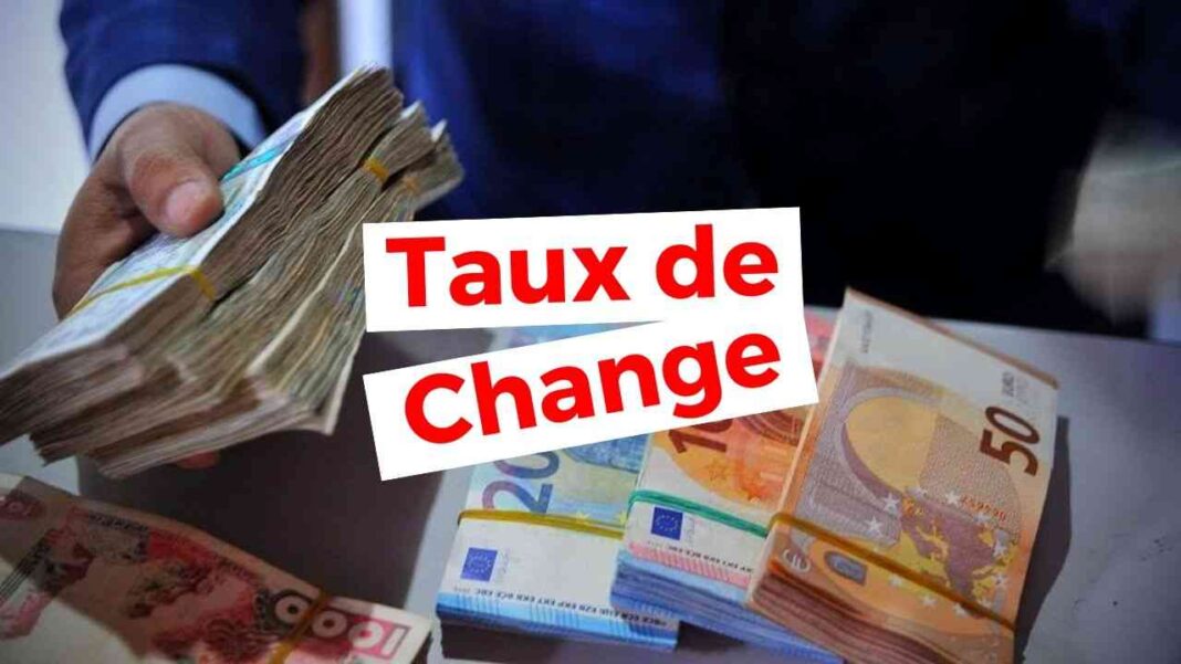 Billets de banque en euros et dinars algériens, échange en cours.