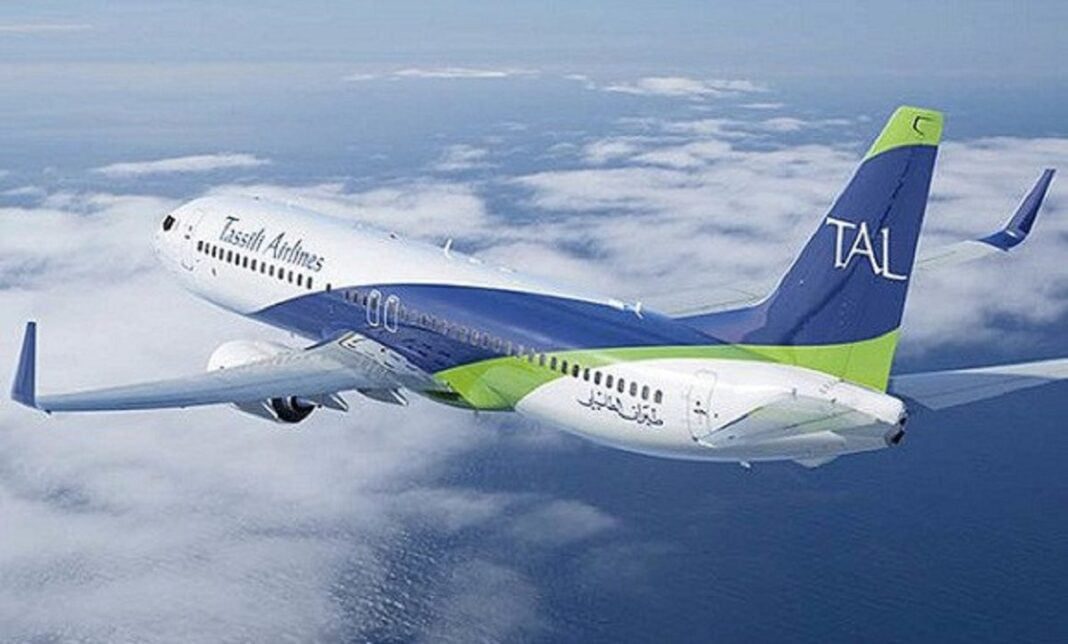 Tassili Airlines en vol vers l'Algérie Avion Tassili Airlines en vol au-dessus des nuages.