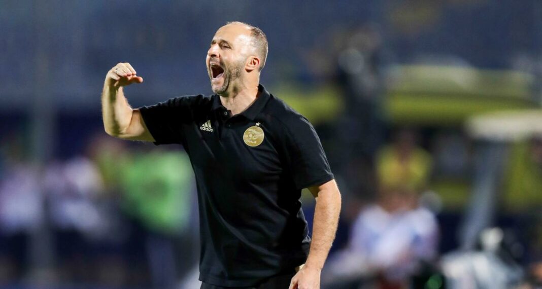 Djamel Belmadi, entraîneur de football, en pleine célébration.