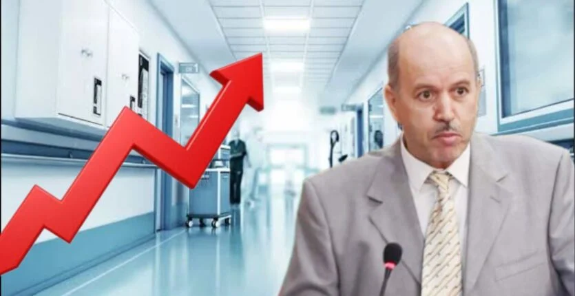 Homme en réunion dans un hôpital avec graphique de croissance.