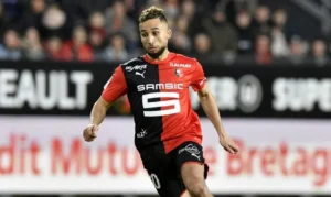 Rafik Guitane joueur de football en action sur le terrain.