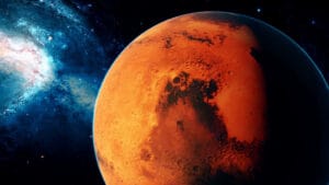 Recherche de vie sur Mars : L'Algérie détient elle la boite de pandore? Planète Mars avec surface rouge et cratères, dans l'espace cosmique étoilé.