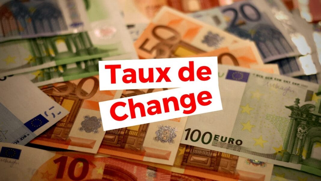 Billets d'euros et de dinars algériens, taux de change en évidence.