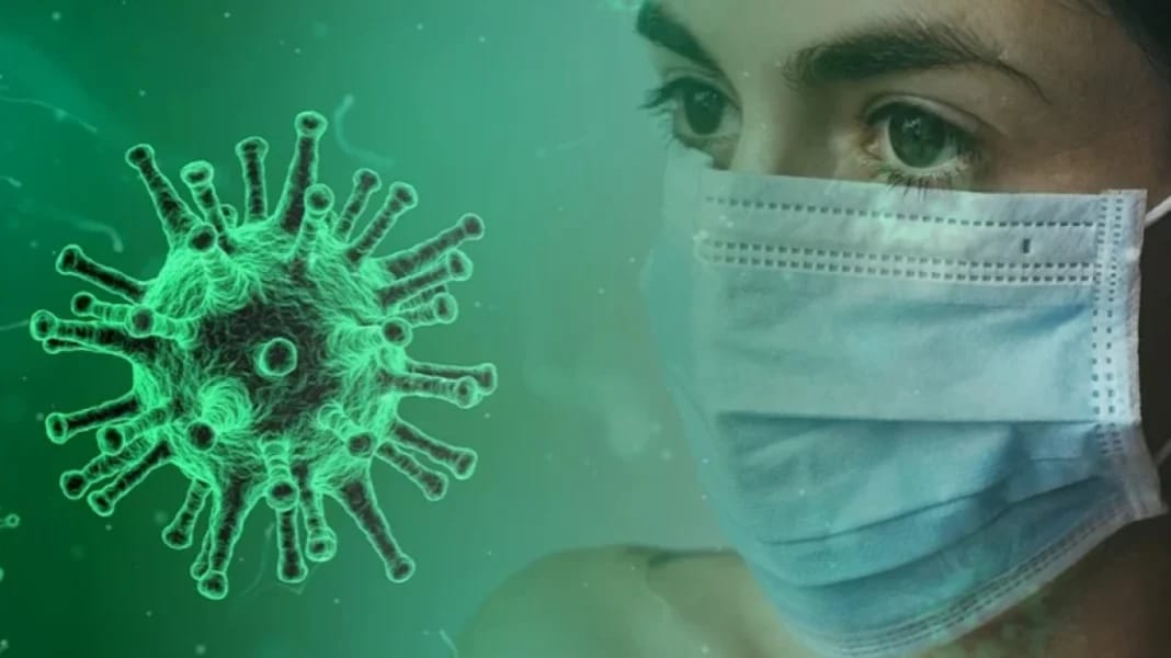 Corona : Voici ce qu’il faut savoir sur « Iris » la nouvelle mutante Virus COVID-19 et personne portant un masque facial.