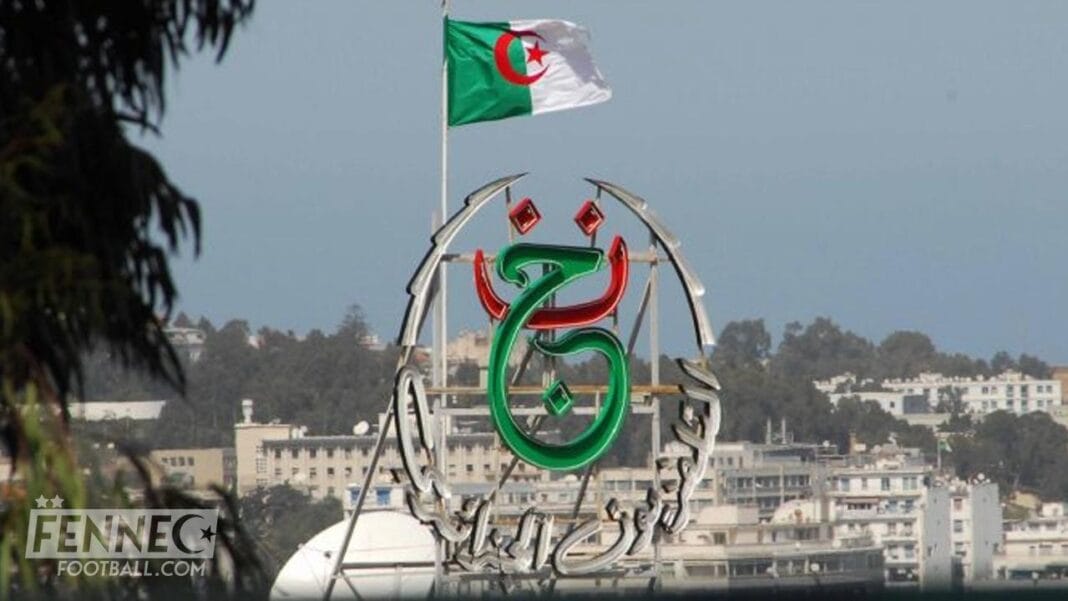 Incroyable mais vrai ? le DG de la chaîne ENTV limogé à cause du match Maroc Portugal Drapeau algérien flottant avec logo de la chaîne ENTV en arrière-plan.