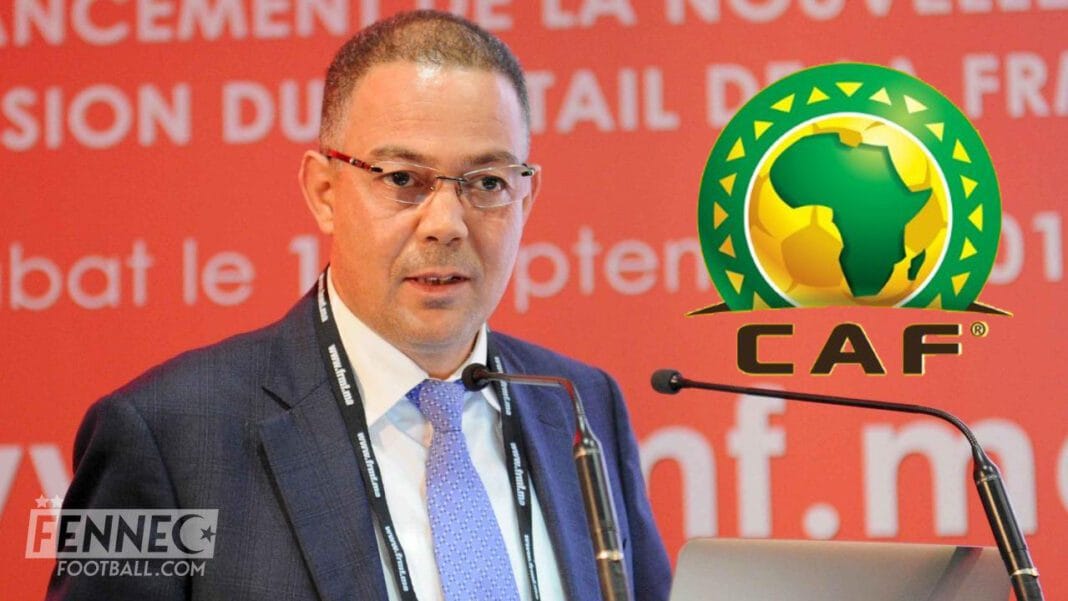 Débat CAF entre Maroc et Algérie Homme en costume lors d'une conférence CAF, logo CAF visible.