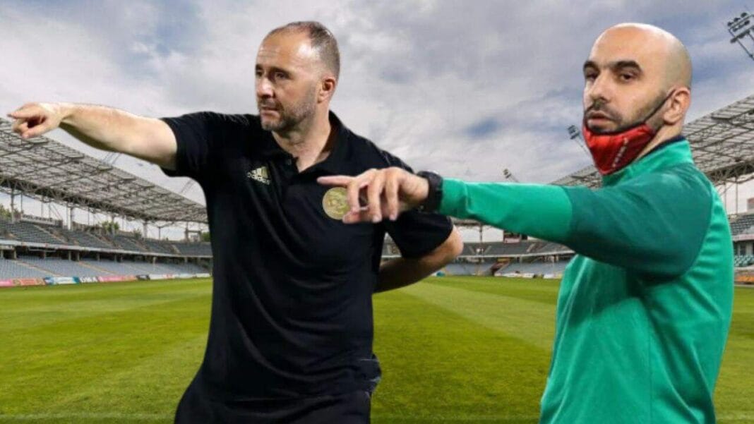 Maroc : Walid Regragui annonce une tournée européenne – Une stratégie à la Djamel Belmadi Walid Regragui et Belmadi en discussion sur le terrain de football.