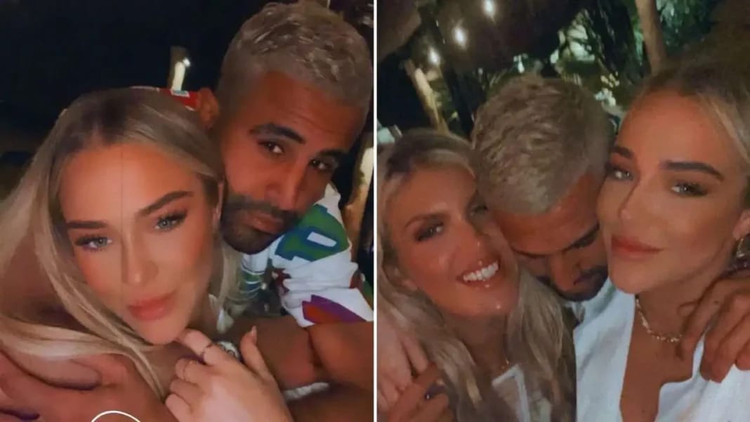 Riyad Mahrez entouré de deux femmes souriantes lors d'une soirée.