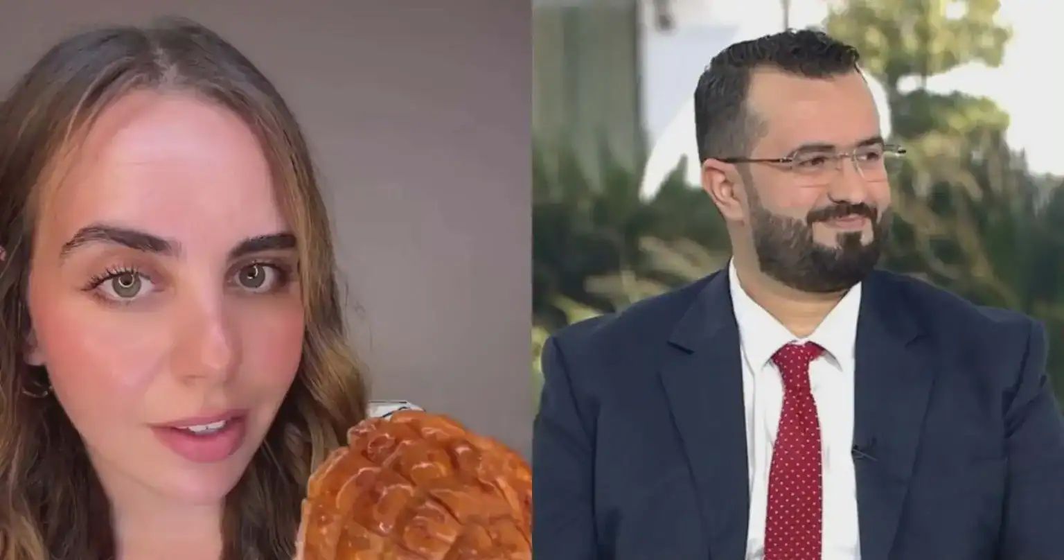 Deux personnes, une femme et un homme, en discussion en extérieur.