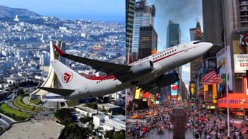 Avion décollant de la ville de New York avec gratte-ciel en arrière-plan.