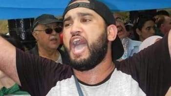 Manifestant en Tunisie soutenant Zakaria Hannache réfugié.