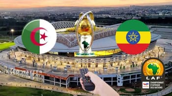 Stade de football avec drapeaux d'Algérie et d'Éthiopie lors d'un match.