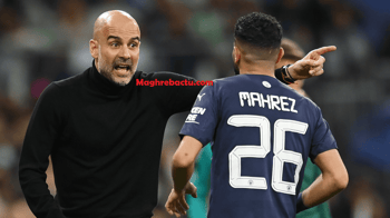 Guardiola donne des instructions à Mahrez sur le terrain de football.