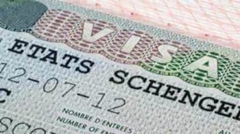 Visa Schengen avec tampon d'entrée sur passeport algérien.