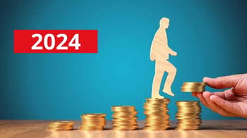 Représentation de la croissance des salaires en 2024 avec des pièces de monnaie.