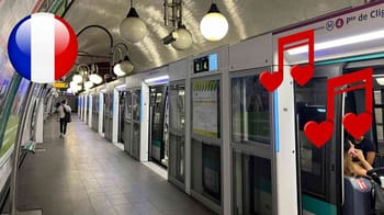 Décor romantique dans le métro parisien avec cœurs rouges et drapeau français.