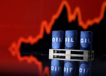 Barils de pétrole avec graphique de marché en arrière-plan.