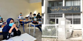 Étudiants passant l'examen dans une salle avec masques de protection.