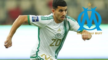 Youcef Atal, joueur de football, en pleine course sur le terrain avec logo OM.