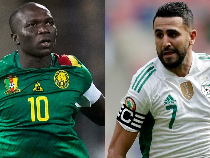Riyad Mahrez en maillot vert, concentré sur le jeu.