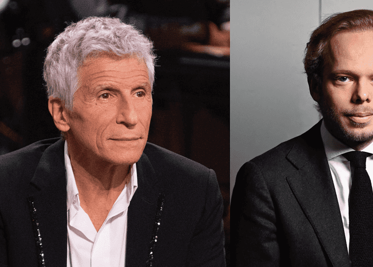 Nouvelle incidence algérienne dans une dispute française Deux hommes en costume lors d'une discussion sérieuse.