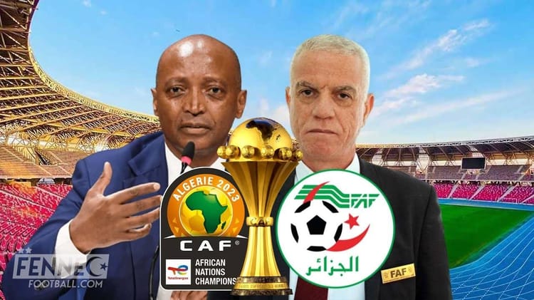 CAN 2025 : Les grosses révélations de Sebgag sur Motsepe Deux hommes en costume parlent lors d'une conférence de presse de football.