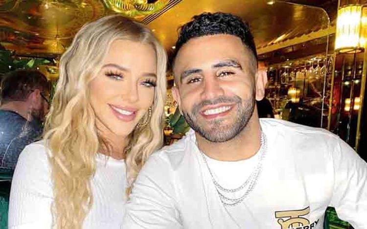 Riyad Mahrez : Un geste qui fait réagir les supporters algériens Riyad Mahrez et sa femme souriants lors d'une sortie.